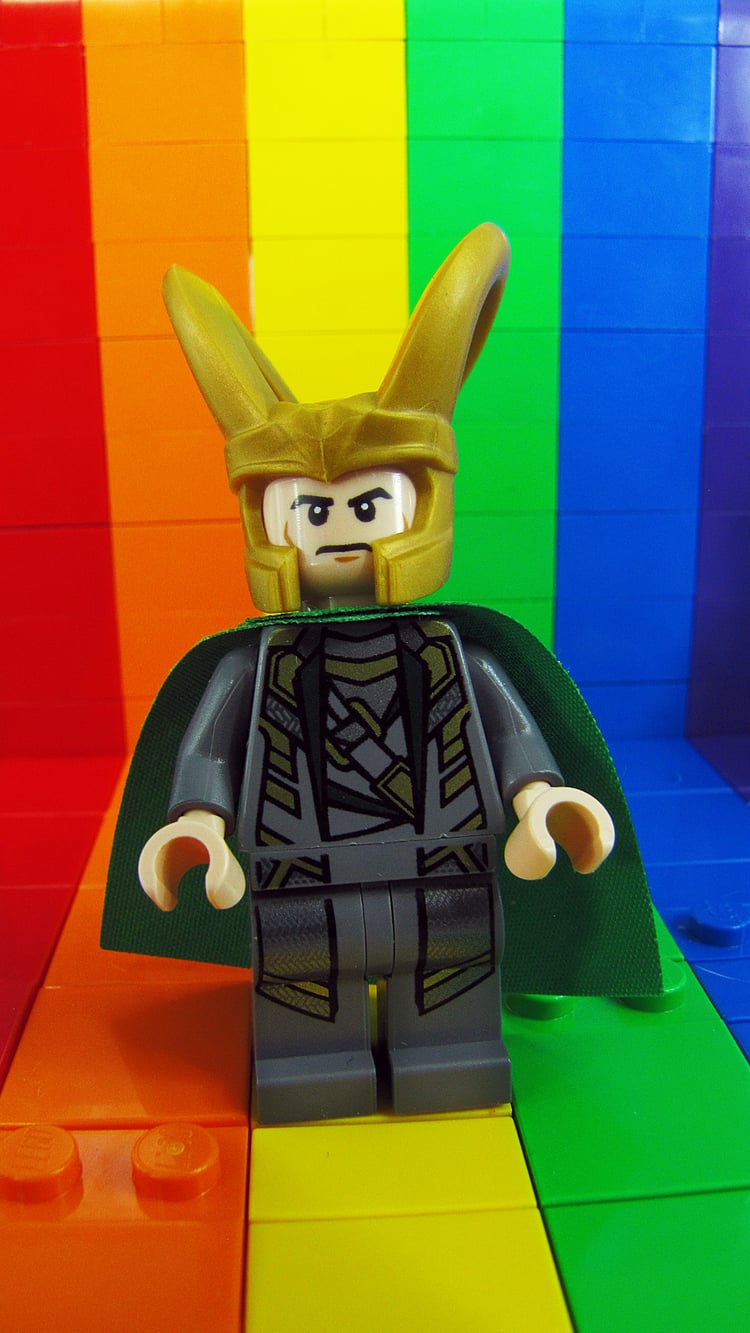 LEGO Loki minifig on a lego brick in rainbow colors