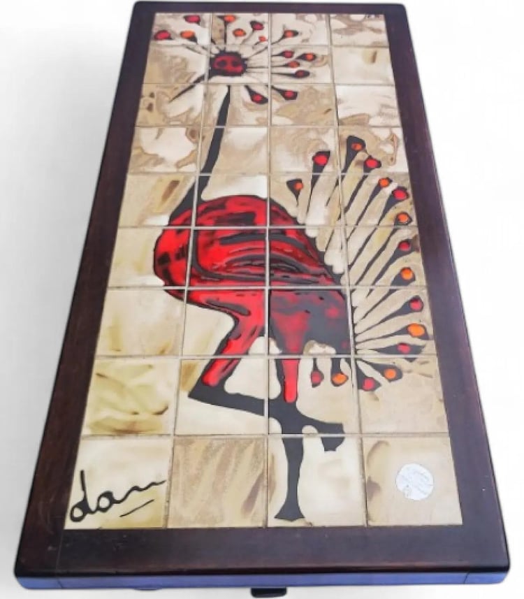 mid-century coffee table featuring a hand-painted Gray Crowned Crane motif, signed ‘Dan’
