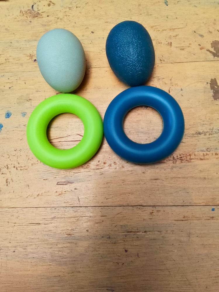Stress ball and rings for muscle activation