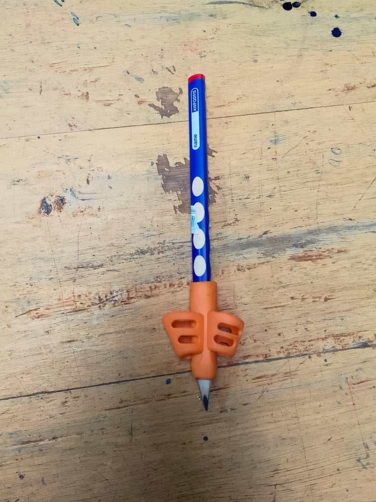 Pencil grip on an indented pencil