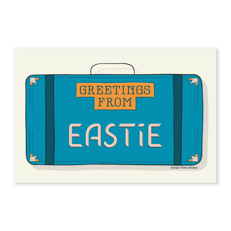 A postcard of a vintage style suitcase with the words “Greetings from Eastie" drawn in unique lettering styles. Artwork has a blue and orange color scheme