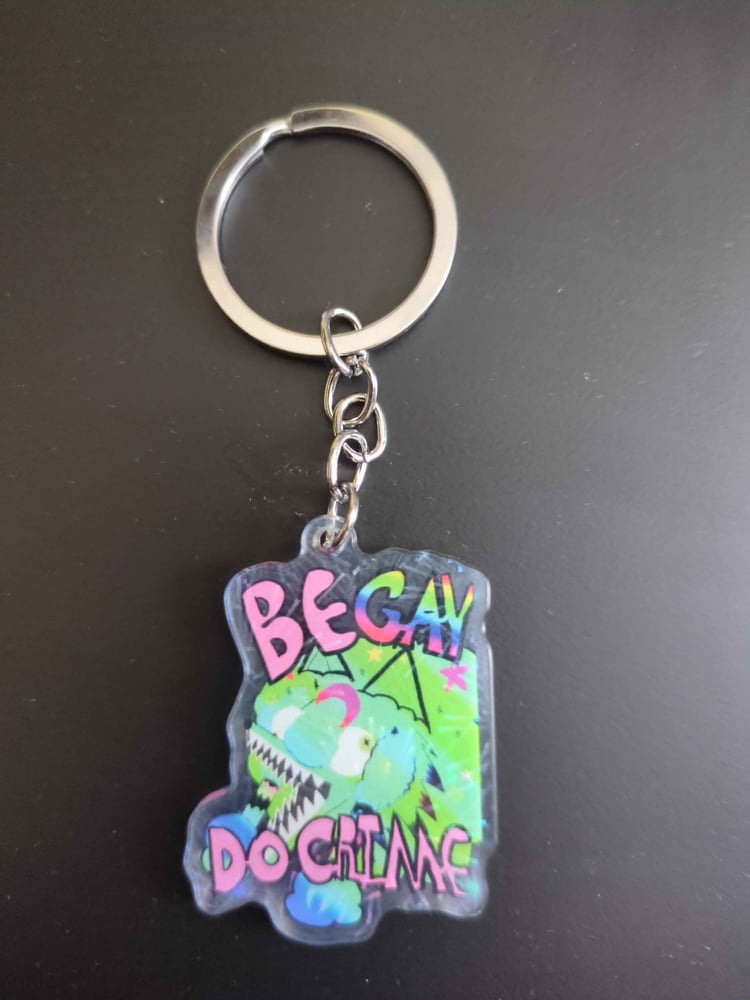 Green Sparkle COyote girl head in green sparkles covered in stars and moons blue green gradient with pink text that reads "Be Gay Do Grime" Gay text is rainbor. Wide mouth, braids and eyes looking the wrong directions. front