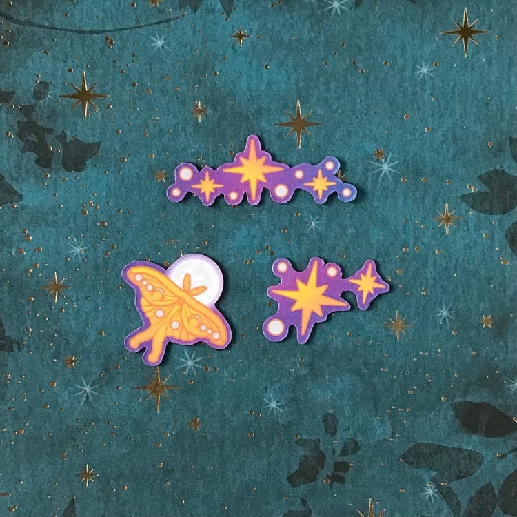 A trio of mini magnets featuring a luna moth and stars.