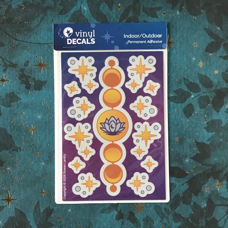 Vinyl sticker sheet featuring moon phases with a lotus, plus multiple star clusters and single stars.
