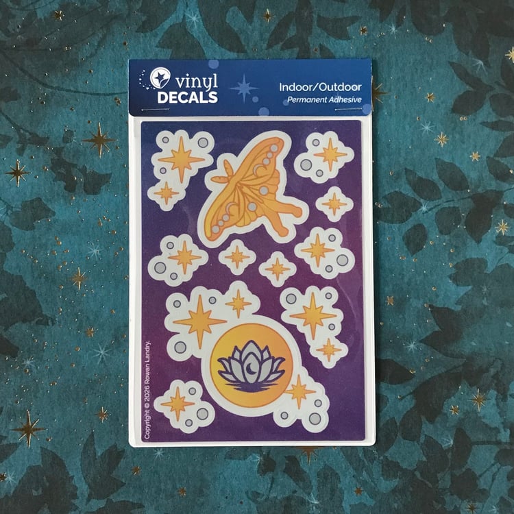 A vinyl sticker sheet featuring a luna moth and moon with lotus, plus stars.