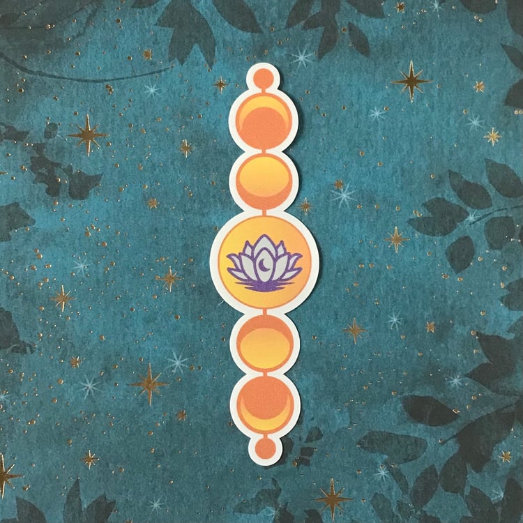 A large vinyl decal featuring a lotus within a set of moon phases.