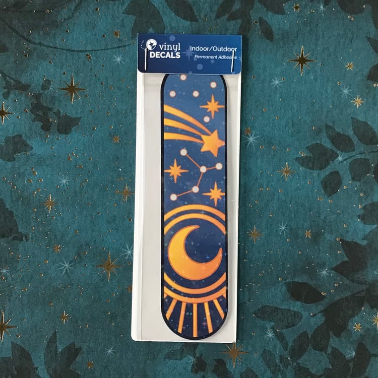 The large blue, moon and stars-themed decal in its packaging.