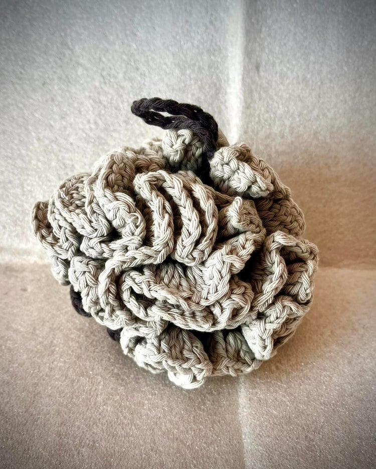 Grey crochet bath pouf made from cotton