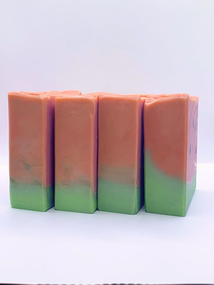Group of handmade watermelon soaps shown from the side