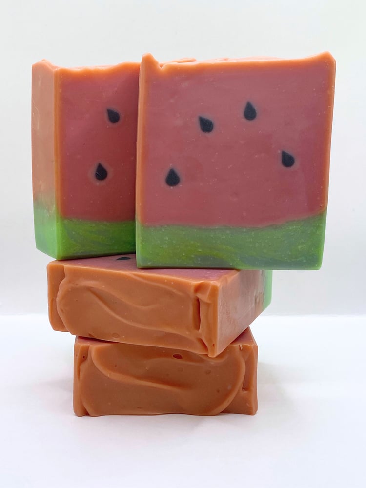 Stack of handmade watermelon soaps shown from the front and top