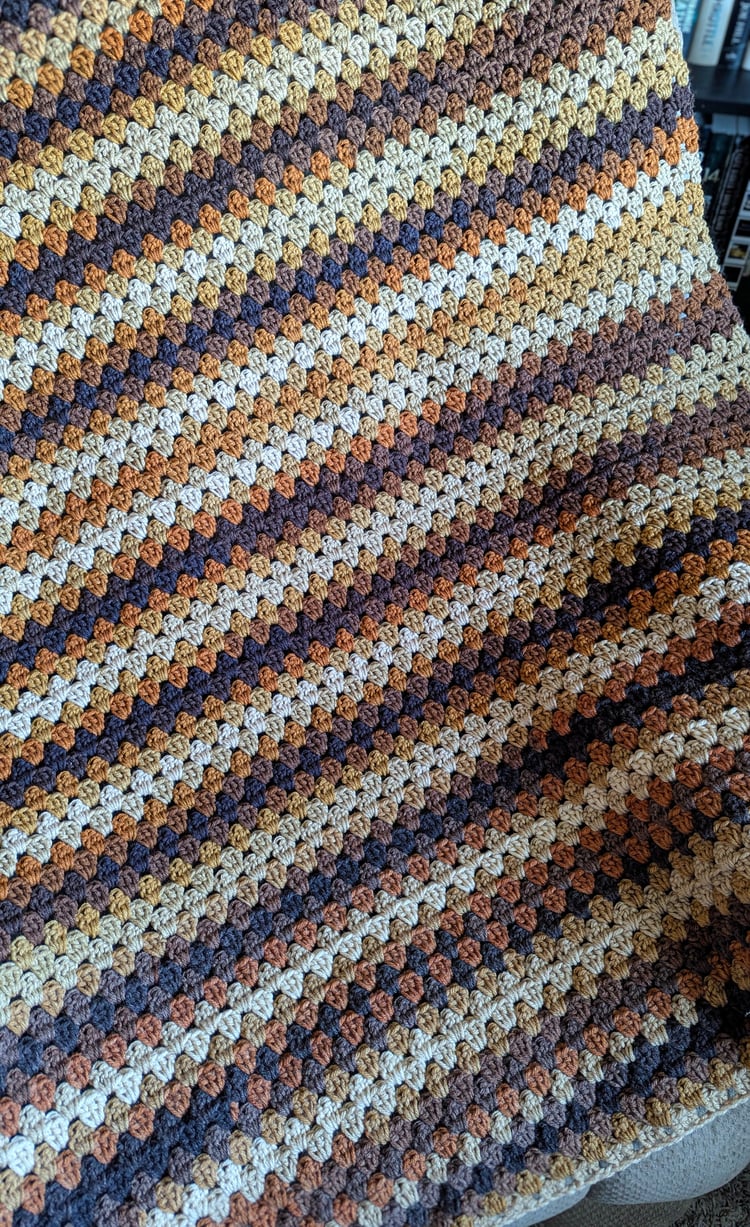 Vintage granny stripe blanket on chair