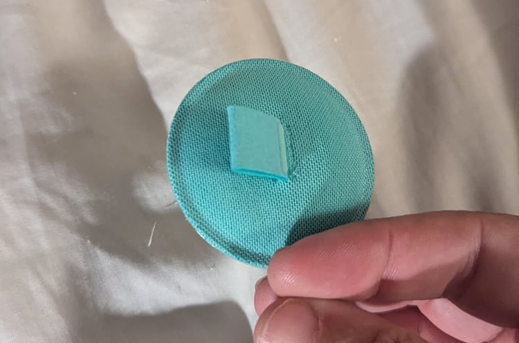 Backside, featuring the "adjustment TAB"