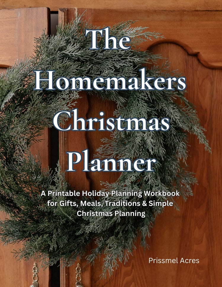 Christmas wreath hanging on a rustic wardrobe door featuring the Homestead Christmas Planner, a 46-page printable holiday planner PDF for Christmas planning, gift organization, budgeting, meal planning, and holiday preparation.