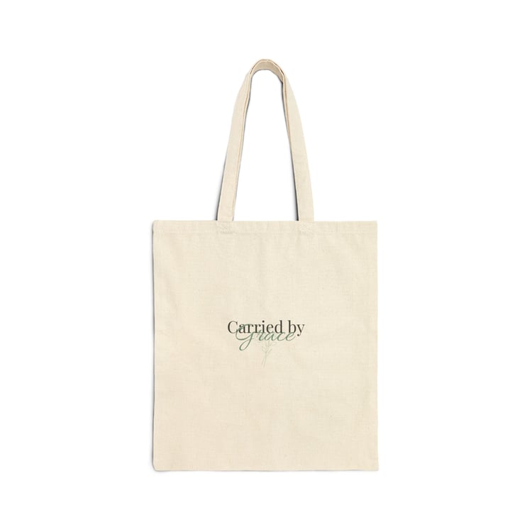 “Carried by Grace cotton tote bag with minimalist text design on the front, displayed on a clean background.”