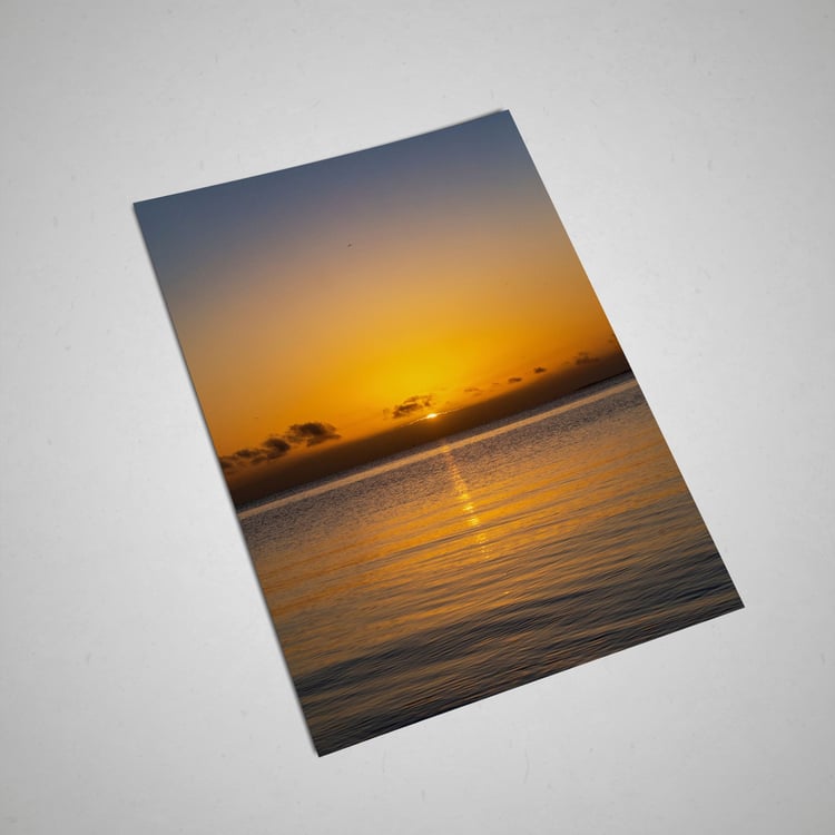 Fine art sunrise photography featuring golden light over the ocean. High-resolution digital download and printable wall art for calm, nature-inspired interiors.
