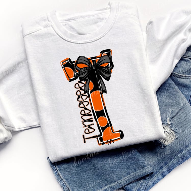 Doodle T with polka dots and black bows on white sweatshirt