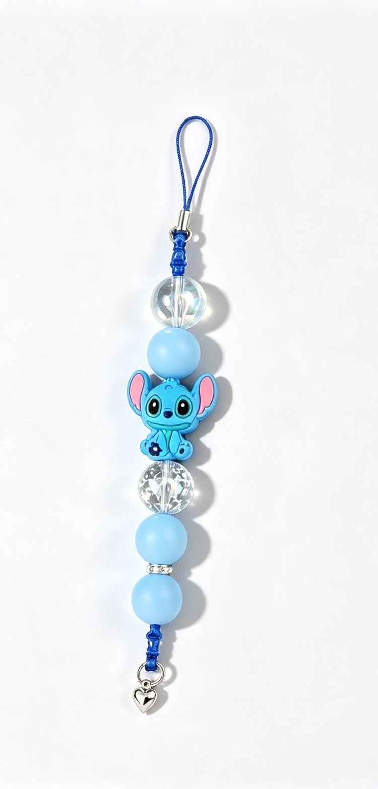 Handmade Stitch phone charm with blue and clear beads, silver heart charm and dark blue cord loop