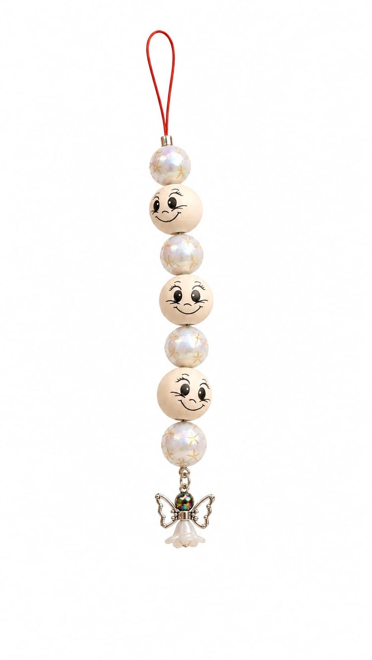Handmade Sugarplum Pearl Angel Christmas ornament with pearlescent star beads, wooden smiley face beads, silver angel charm and red hanging cord