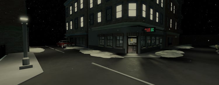 Snowy club exterior at night
