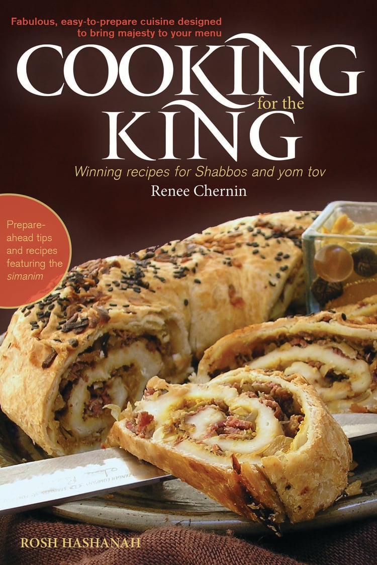 Queen in the Kitchen Royal Recipes & Tips for a Sweet New Year by Renee Chernin On Rosh Hashanah, we dress the table in white, we bring out our finest, and we serve dishes rich in meaning and intention. The foods we eat become our prayers. Each siman—carrot, beet, leek, date, apple, pomegranate—is a vessel for a heartfelt request: for sweetness, protection, abundance, clarity. These are not mere customs; they are actions filled with spiritual energy. The Simanim Salad gathers all those symbolic ingredients in one vibrant, jewel-toned dish. It’s more than a salad—it’s a statement of hope, a taste of blessing to begin the new year. Simanim Salad All of the “signs” in one jewel-toned salad. The perfect way to begin your yom tov meal! Prepare the components ahead and assemble just before serving. Dressing: 2 tablespoons + ¼ cup vegetable oil Juice of one small lime 3 tablespoons honey 1 tablespoon raspberry jam or fruit spread 1 teaspoon cinnamon ½ teaspoon salt ¼ teaspoon black pepper Salad: 2 leeks (white part only), washed well and sliced thinly 3 carrots, peeled and shredded 1 beet, peeled and shredded 1 apple, peeled and shredded 3 dried dates, pitted, diced Pomegranate seeds (optional) Toasted pumpkin seeds (optional) Instructions: 1. In a small bowl, whisk together the 2 tablespoons of oil, lime juice, honey, jam, cinnamon, salt, and pepper. 2. In a small pan, heat the ¼ cup of oil until it just begins to smoke, about 5 minutes. Fry the leeks in the oil until golden brown, 3–5 minutes. Drain on paper towels until cool. 3. In a medium bowl, toss the shredded carrots, beets, and apple with just enough dressing to coat. Toss them either separately to maintain their colors, or all together so that the apple and carrot will take on the ruby tint of the beets. Refrigerate until cold. 4. When ready to serve, assemble the salad: Either on individual plates or on a serving platter, mound the carrots, beets, and apple, sprinkle with the seeds and dates, and top with the fried leeks. Serve extra dressing on the side. Makes 8–12 servings Active time: 20 minutes PREPARE AHEAD: You can prepare the dressing up to 5 days ahead of time. Store it tightly covered in the refrigerator. The fried leeks will keep in the freezer (in a plastic bag) for up to 2 weeks. The tossed shredded carrot, apple, and beets will stay fresh in the fridge for up to 24 hours. Queen in the Kitchen Fish Tips Whether it is a matter of location or one of convenience, purchasing fresh fish is often not an easy option. I am regularly asked, “Is fresh always best?” Maybe, maybe not. Unless you caught the fish yourself, you really have no way of knowing exactly how fresh it is. Nowadays fish is often frozen within hours of a catch, and this method can even result in a superior product to the fresh fish at your local market. But choosing really fresh fish is easy if you know what to look for: • Smell it: fresh fish should smell fresh, like cucumbers. • See it: the flesh color should be vibrant, the skin shiny and metallic. • Any liquid from fresh fish should be clear and not milky. With these tips, you can also make the most of your frozen fish purchase: • Purchase only vacuum-packed fish or fish labeled “flash” or “quick” frozen. This means they were frozen within hours of the catch. • The best varieties to buy frozen are salmon, tilapia, halibut, and flounder. • Thaw fish slowly in the refrigerator. Thawing under water or in the microwave diminishes the flavor and texture of the fish. • After thawing, drain, rinse, and pat fish dry before preparing. Brown Sugar Salmon The sweet and salty combination in this recipe brings out the natural flavor of the fish and its simple preparation adapts to many presentations. 3 pounds salmon fillet 3⁄4 cup brown sugar 4 tablespoons tamari or soy sauce 1 tablespoon lemon juice 1. Combine all the ingredients and marinate in a tightly covered storage container in the refrigerator for 30 minutes to overnight. 2. Preheat the oven to 350° F. Line a baking pan with foil. Transfer the fish from the container to the baking pan, discarding the marinade. Bake until the center is opaque and flaky, about 20 minutes. Do not overbake. QUEEN IN THE KITCHEN TIP: Smaller fillets require less time in the oven than a whole fillet. Bake just until fish is firm and opaque, and flakes with a fork. Makes 10–15 servings Active time: 5 minutes Cooking time: 20 minutes PREPARE AHEAD: Brown Sugar Salmon will keep in the refrigerator, tightly covered, for up to three days. Queen in the Kitchen Honey Cake A Queen in the Kitchen recipe is adaptable and forgiving, just as a wife and mother must be. This honey cake, my version of Marcy Goldman’s famous Definitively Moist and Majestic Honey Cake, is both. It is a sweet and tender cake with just the right spice—also essential characteristics for the Queen of a Jewish home. This cake is best made a day or two ahead. 31⁄2 cups all-purpose flour 1 teaspoon baking powder 1 teaspoon baking soda 1⁄2 teaspoon salt 2 teaspoons ground cinnamon 1 teaspoon ground cloves or ginger 1 teaspoon ground allspice 1 cup oil 1 cup honey 3⁄4 cup sugar 3⁄4 cup light brown sugar 4 eggs, room temperature 1 teaspoon vanilla 1 cup coffee, strong black tea, or flat cola 1/3 cup orange or apple juice 1/3 cup bourbon or rum, or substitute with one of the above liquids 1⁄2 cup raisins, dried cranberries, or chocolate chips (optional) 1. Preheat the oven to 350° F. Prepare either two 9x9-inch cake pans, one 9 x-13-inch cake pan, three loaf pans, or one 9-inch tube pan (see tip on page xxx). It is also recommended to line the bottom of the pan with parchment paper. 2. In a large bowl, whisk together the flour, baking powder, baking soda, salt, cinnamon, cloves or ginger, and allspice. Make a well in the center, and pour in the oil, honey, sugars, eggs, vanilla, coffee or tea, juice, and liquor. 3. With an electric mixer on slow speed, blend well, making sure that no ingredients are stuck to the bottom. Fold in the raisins, dried cranberries, or chocolate chips, if desired. The batter will be thick. 4. Spoon the batter into prepared pans. Place cakes on baking sheets in the oven (this helps to brown the bottoms properly). 5. Bake until the top springs back when pressed gently with your finger: for the sheet cakes and loaves, 40–55 minutes; for the tube or Bundt cake, 1–11⁄2 hours. 6. Let cool on a wire rack for 10–15 minutes, then gently invert cake onto a plate. Makes 20–30 servings Active time: 20 minutes Cooking time: About 1 hour Can freeze for up to 1 month PREPARE AHEAD: The flavor of this cake improves over two days. It will keep, tightly covered, for up to five days. Renee Rousso Chernin, author, recipe developer and creator of the website, TheKosherChannel.com, centers her work on the connection between the practical and inner lives of today’s Jewish woman. Her articles have appeared in dozens of publications and she has published two editions in her series of holiday cookbooks titled Cooking for the King. Renee and her husband David made aliyah in 2007 from Atlanta, Georgia. After 13 years in the Old City of Jerusalem, they now live in Nof Tzion. They are blessed with two married daughters who are amazing moms and cooks, and the cutest grandchildren on earth.
