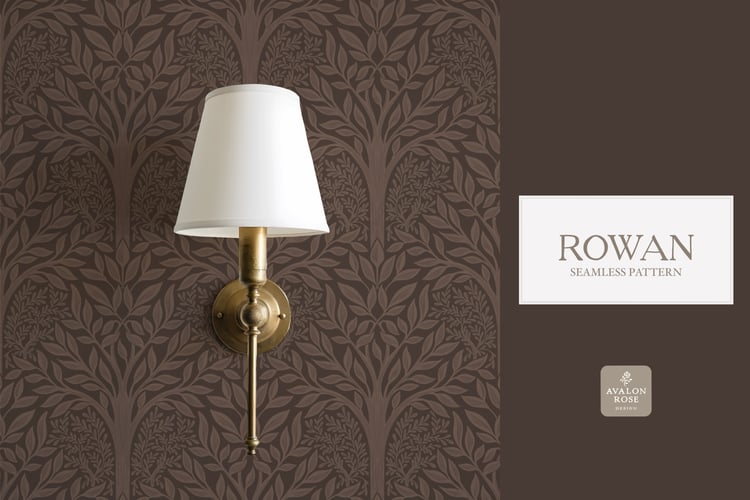 Hand drawn seamless pattern featuring woodland trees and leaves in dark brown on wallpaper behind a brass wall sconce