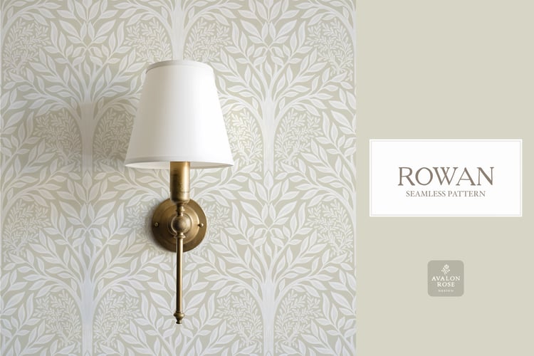 Hand drawn seamless pattern featuring woodland trees and leaves in cream and white on wallpaper behind a wall sconce