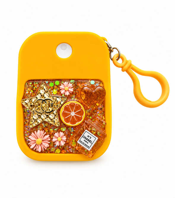 Orange hand cleaner keychain holder decorated with resin, glitter, flowers and miniature citrus details