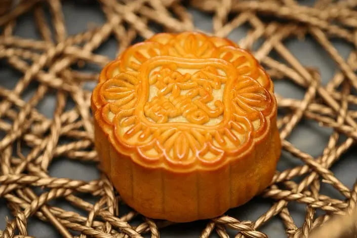 Gâteaux de lune snow-skin à l’igname et sésame noir – recette MTC Qiu Fen digeste