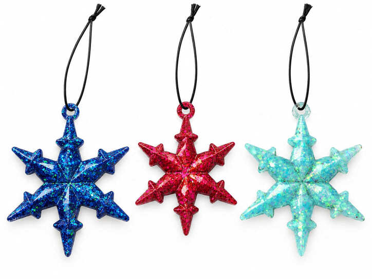 Set of three handmade glitter resin snowflake Christmas decorations in blue, pink and mint with black hanging cords