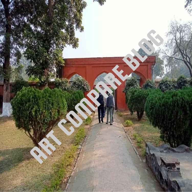Tourists Walking Towards Red Triple-Arched Gateway Leading to Khushbagh Mosque - Historic Garden Path Lined with Trimmed Bushes, Murshidabad