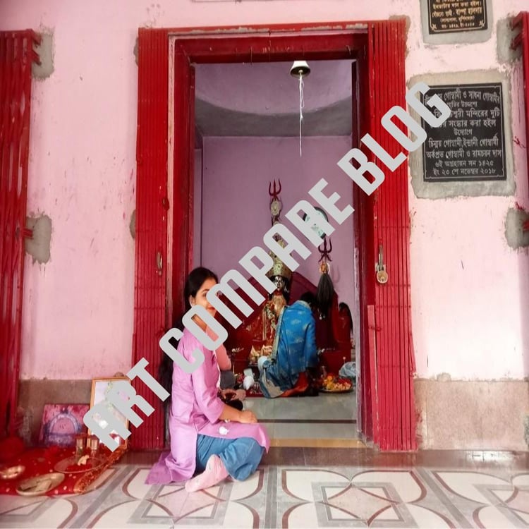Young Woman Sitting at Entrance of Goddess Kiriteshwari Temple with Priest Performing Puja Inside Sanctum - Murshidabad Shakti Peeth