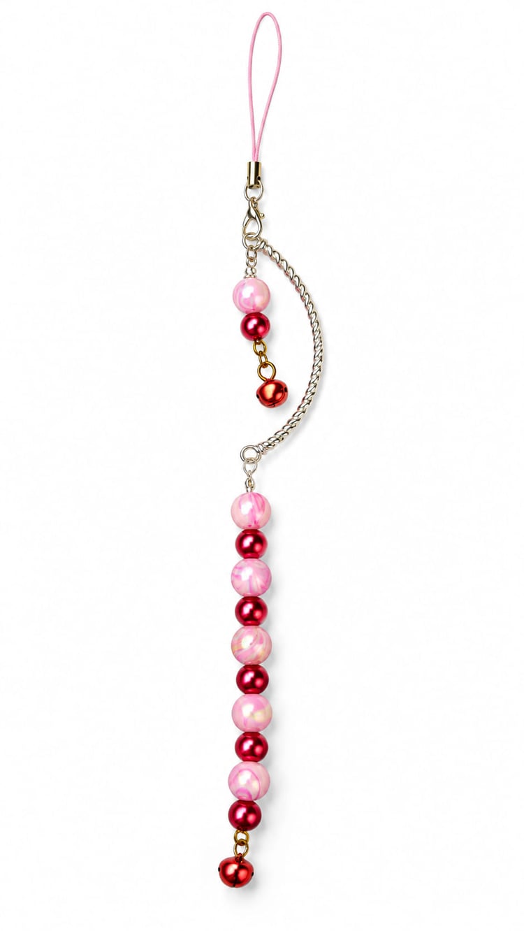Handmade pink and red beaded Christmas decoration with marbled pink beads, metallic red beads, silver-tone crescent and red jingle bells.