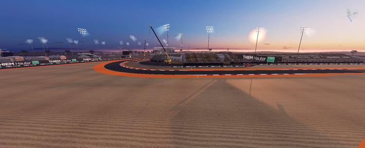 Racing corner with colored runoff zones and floodlights