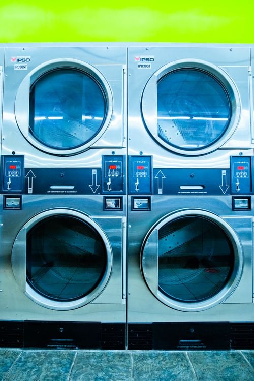 Stock photograph of stacked commercial dryers in a laundromat