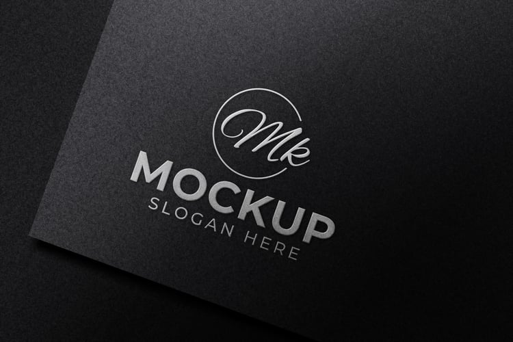 Luxury embossed silver logo mockup on black paper from graphicsregion