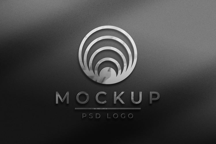 Editable metallic business logo mockup psd in embossed style from graphicsregion