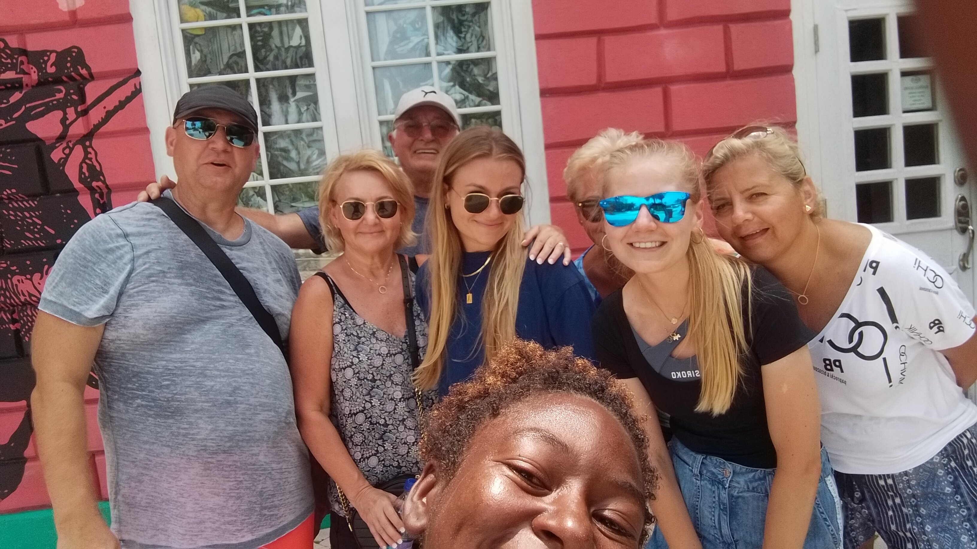KINDWalk, Nassau tour, Nassau walking tour, walking tour Nassau, free walking tour, walking tour, Bahamas tour, French sisters, colorful sign, GrayCliff Heritage village, Bahama Barrels, things to do in Nassau, free things to do, world famous straw market, Nassau straw market, Bay street, Nassau Bahamas