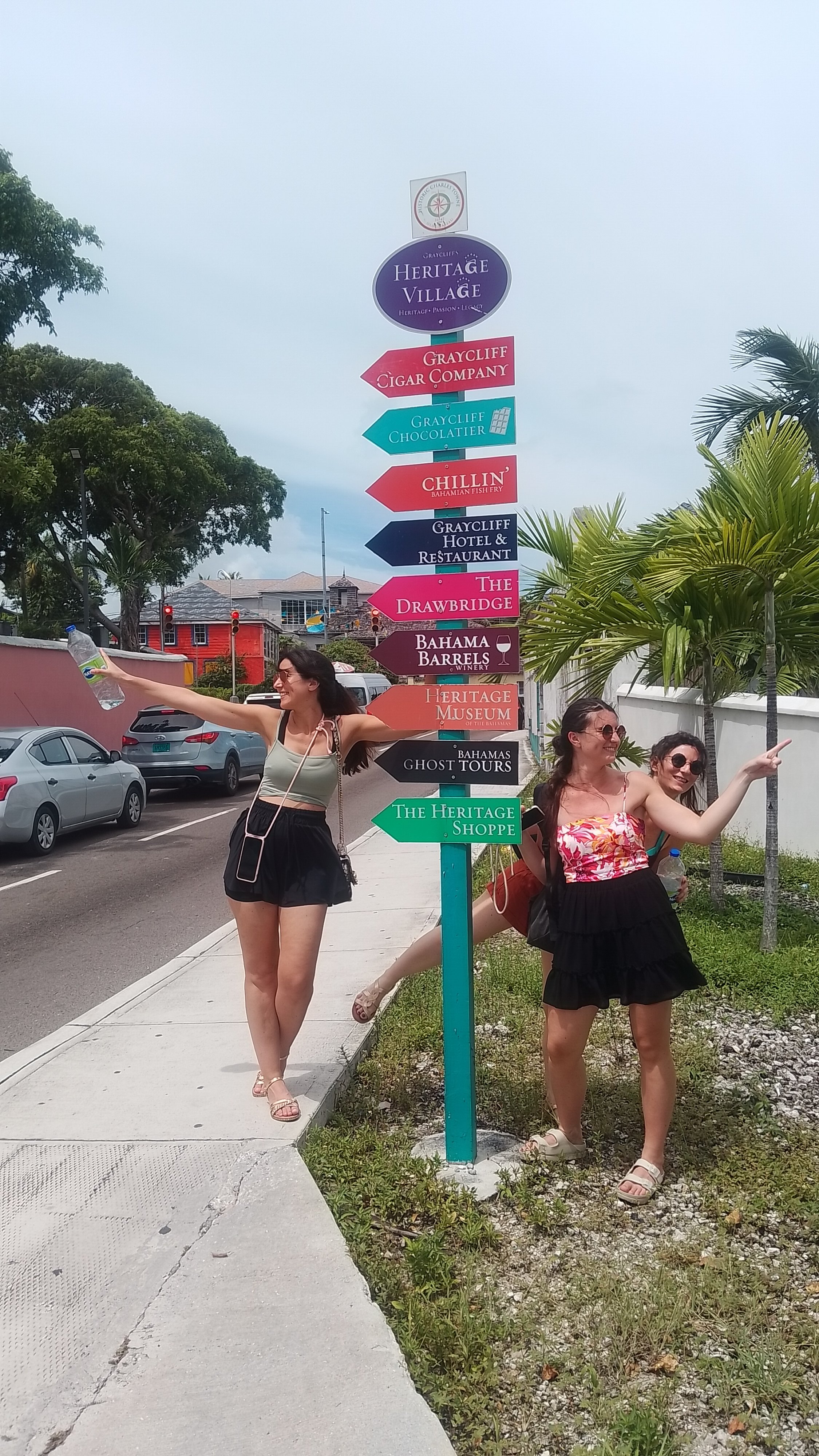KINDWalk, Nassau tour, Nassau walking tour, walking tour Nassau, free walking tour, walking tour, Bahamas tour, French sisters, colorful sign, GrayCliff Heritage village, Bahama Barrels, things to do in Nassau, free things to do, world famous straw market, Nassau straw market, Bay street, Nassau Bahamas