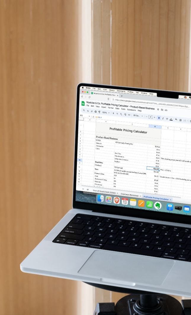 A laptop computer with pricing calculator for product-based musicians on the screen