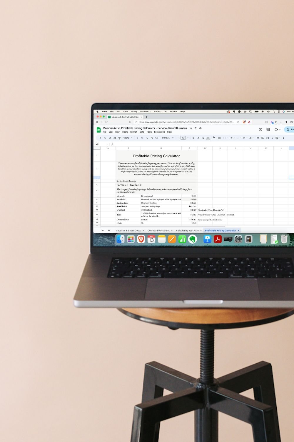 A laptop computer with pricing calculator for service-based musicians on the screen