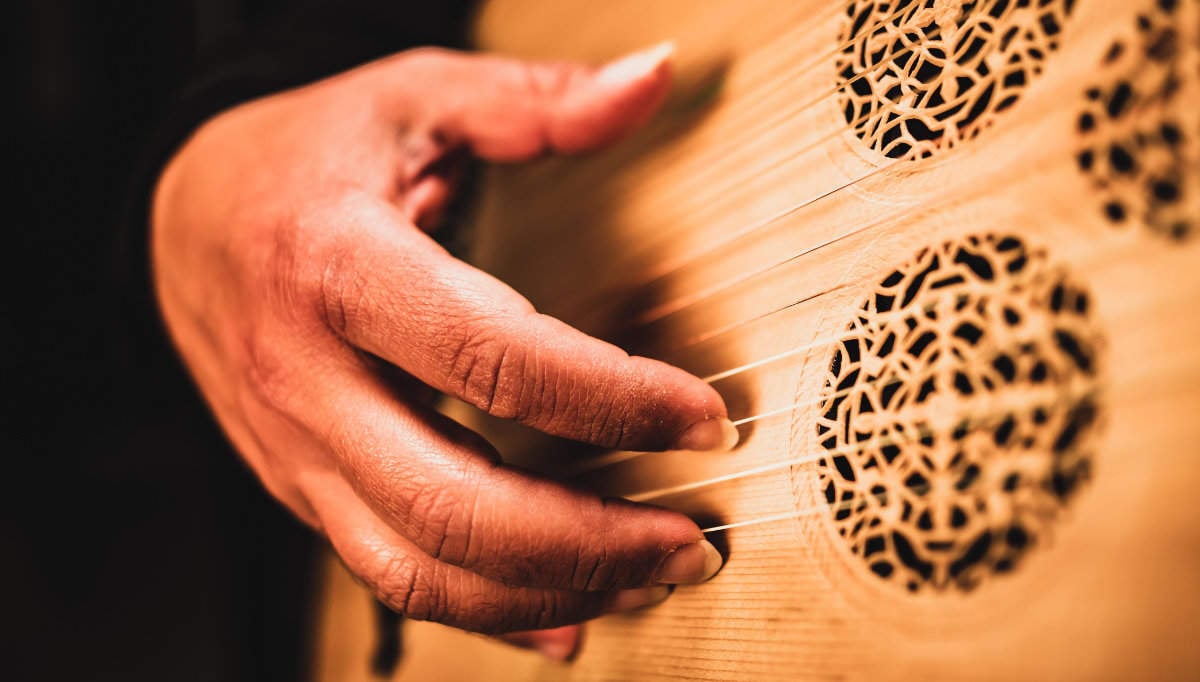 Picture of a hand with classical guitar nails