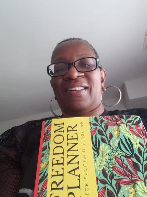 Happy Black Customer & Woman Holding Freedom Planner for Successful Budgeting! Real,, Relevant and Relatable Financial Planner