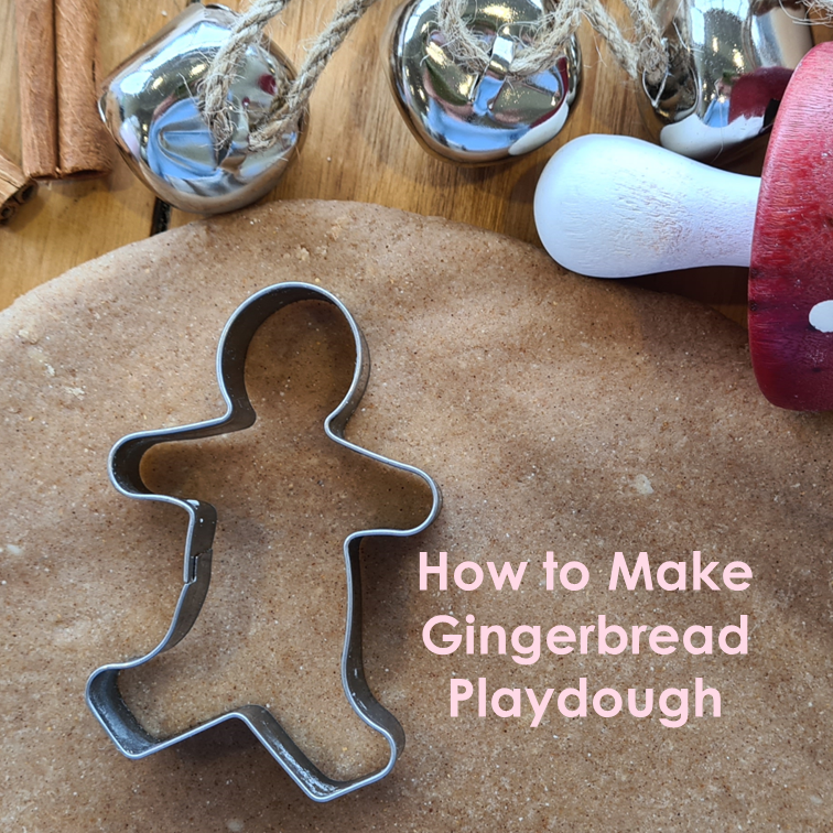 Gingerbread playdough rolled out with a gingerbread cookie cutter.