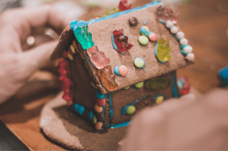 Gingerbread house with gummy bears and candy.