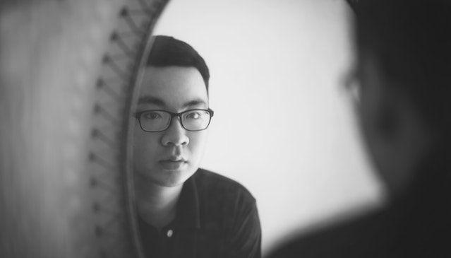 man looking in mirror
