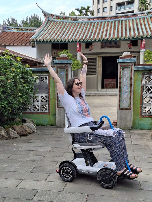 Carrie Kellenberger in her new Robooter power chair in Taiwan.