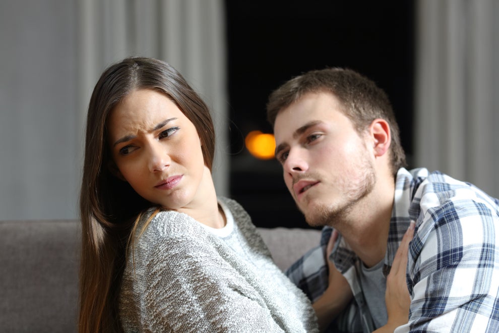 woman pulling away from man