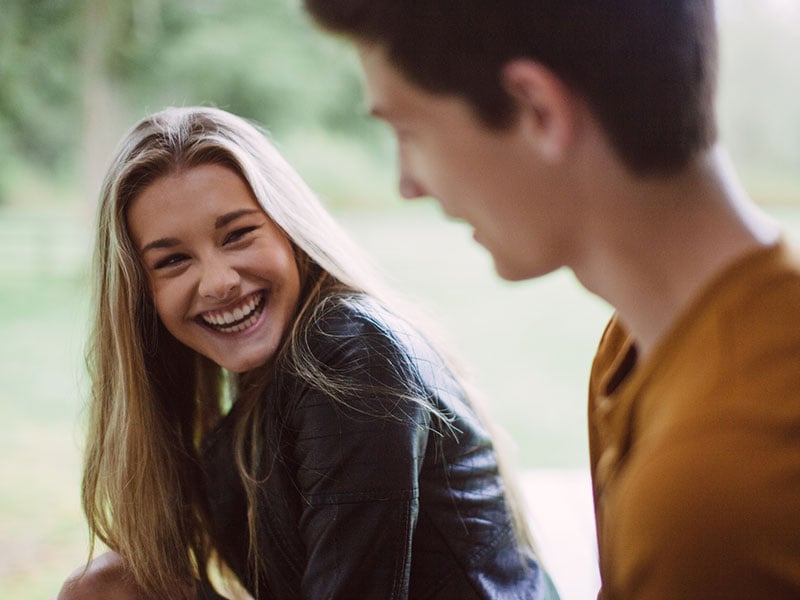 man talking to woman with confidence