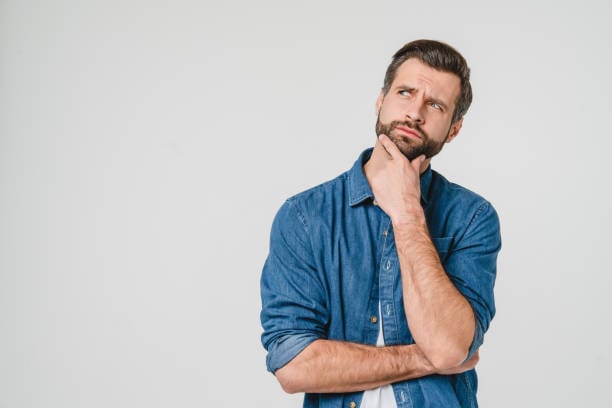 a man in blue shirt thinking