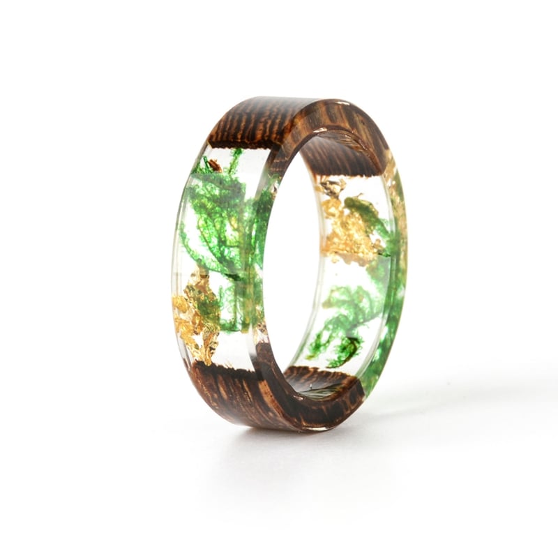 This stunning handmade Wood Resin Ring combines the natural beauty of wood and transparent epoxy resin to create a truly unique piece of jewelry. Featuring delicate, real dried flowers embedded within the resin, this elegant love ring is perfect for weddings, anniversaries, or as a meaningful gift for someone special. Its fashionable 2019 design adds a touch of timeless sophistication, making it an ideal accessory for any occasion. Lightweight, durable, and beautifully crafted, this ring is designed for women who appreciate artisan craftsmanship and nature-inspired elegance.